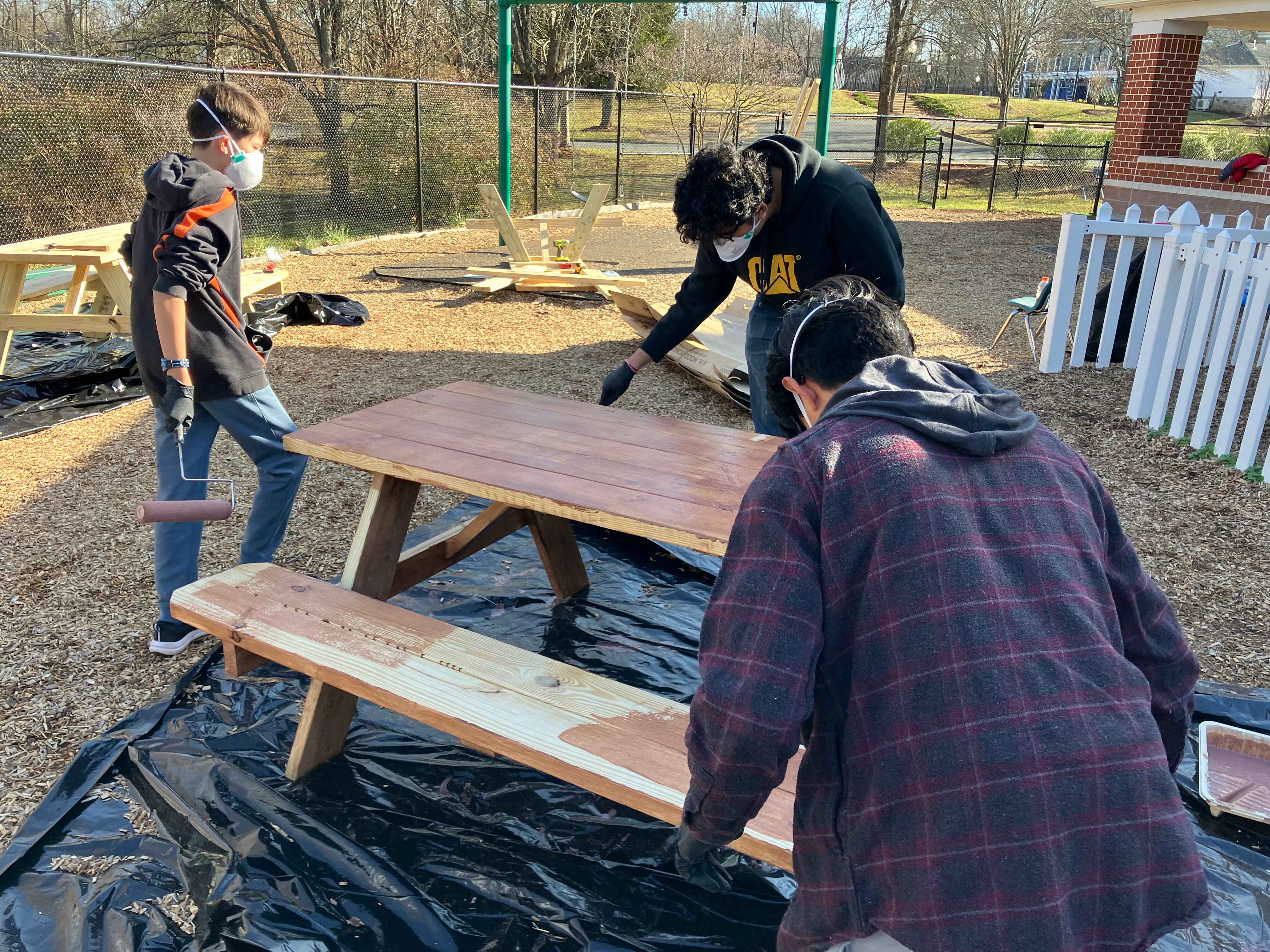 Tables benches being painted